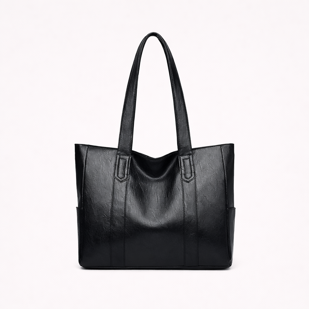 Un bolso tote con asas largas, diseño estructurado y medidas indicadas.